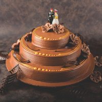Decorated celebration cake with themed toppers