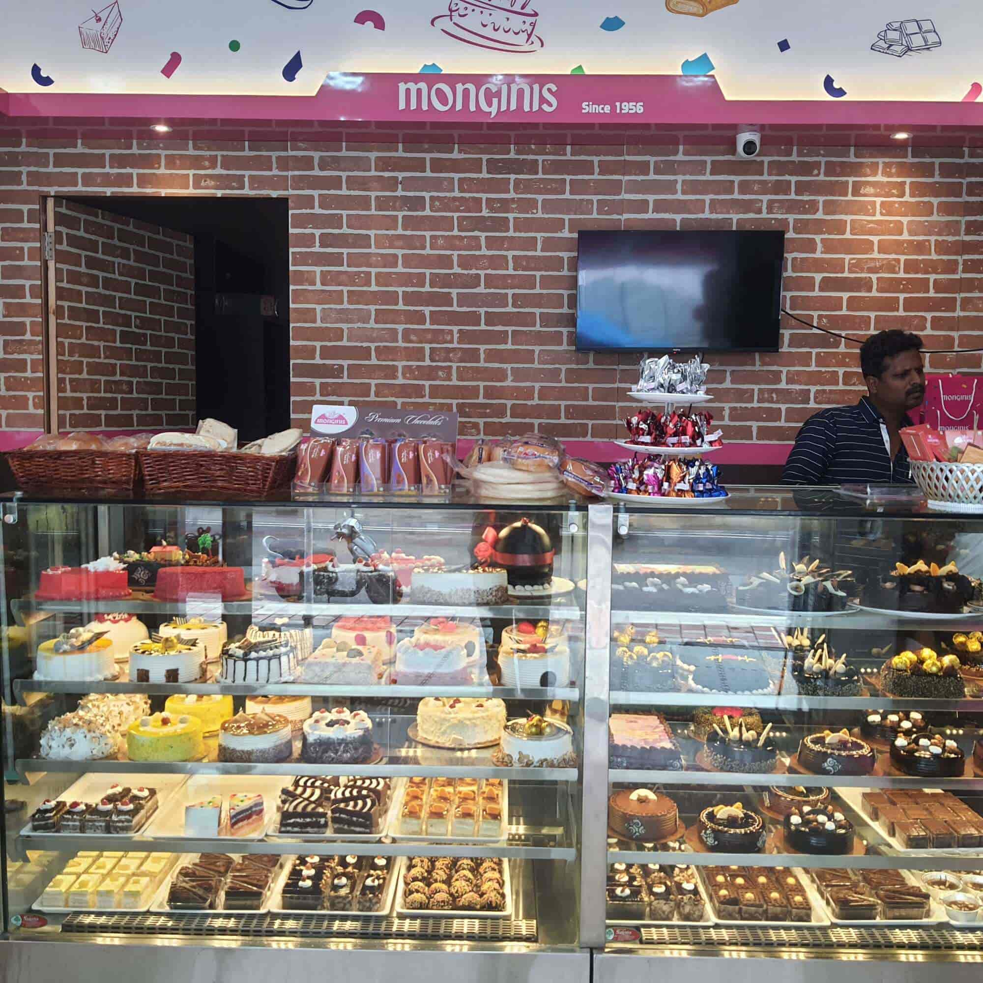 Brick-wall shop interior with pastries and cakes in a glass counter